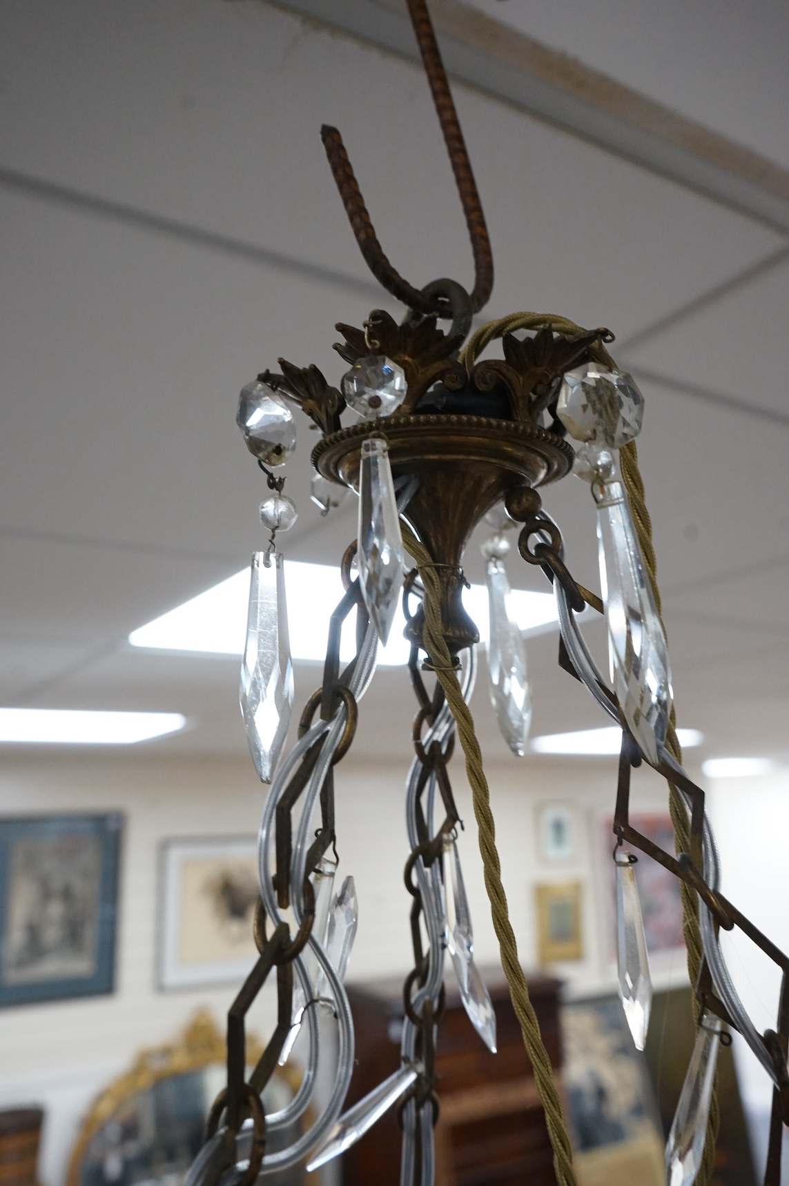 A glass and brass six branch chandelier, 65cm high. Condition - fair